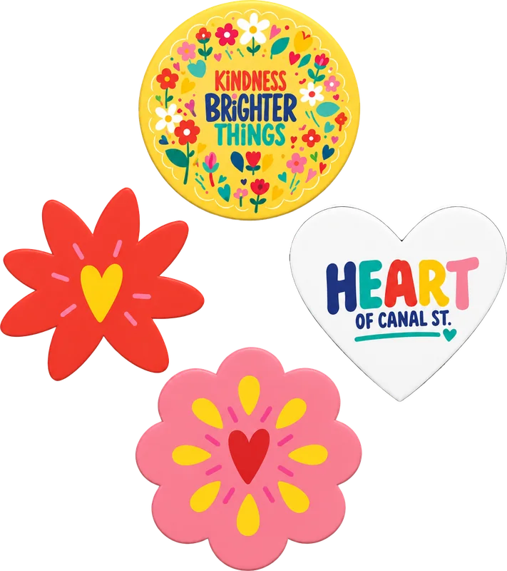 Set of four charms: a yellow wreath disc, a red flower, a pink flower, and a white Heart of Canal St. heart